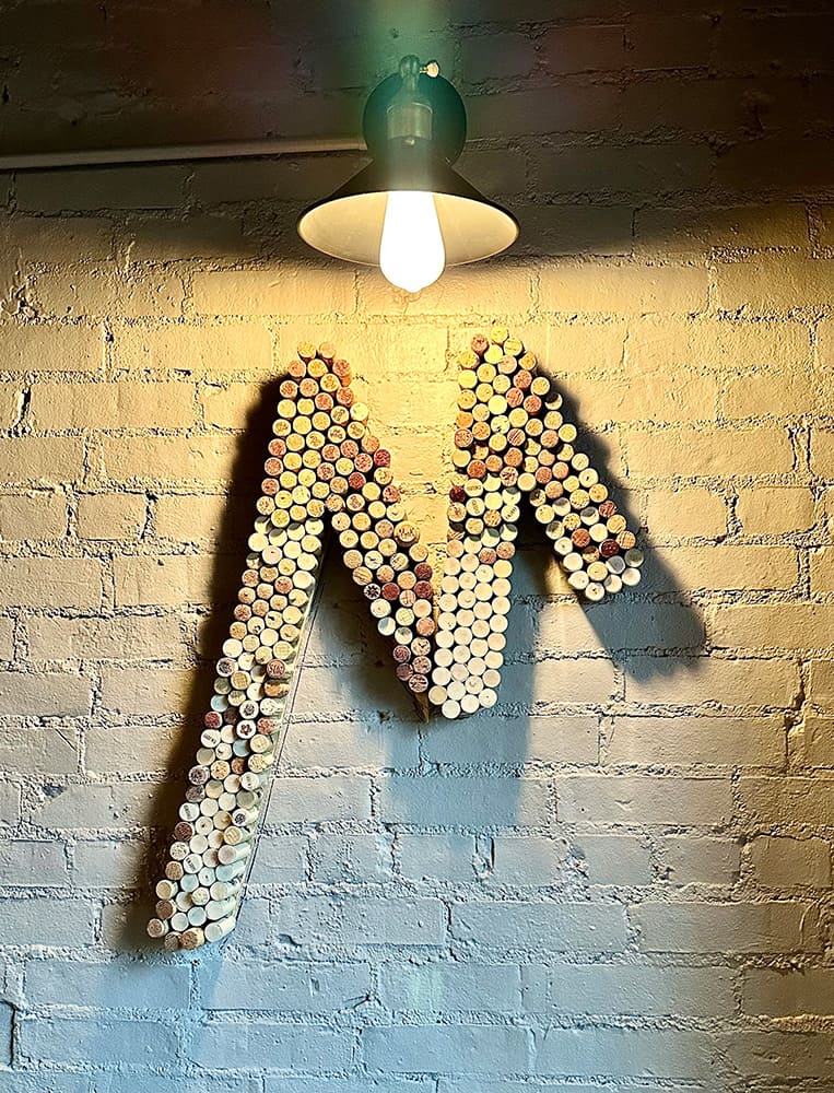The letter m is made out of wine corks.